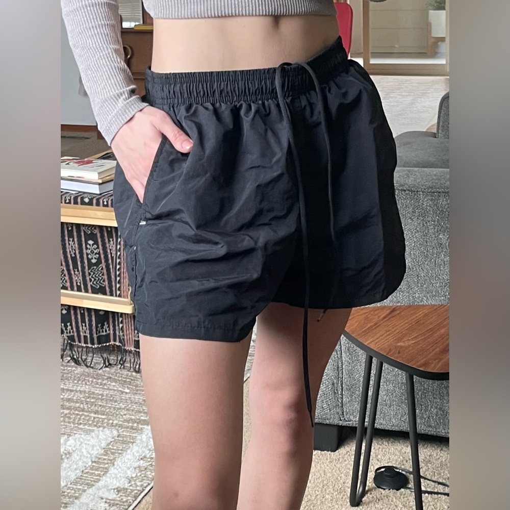 True black shorts with mesh inner liner. Non stretch outer material.